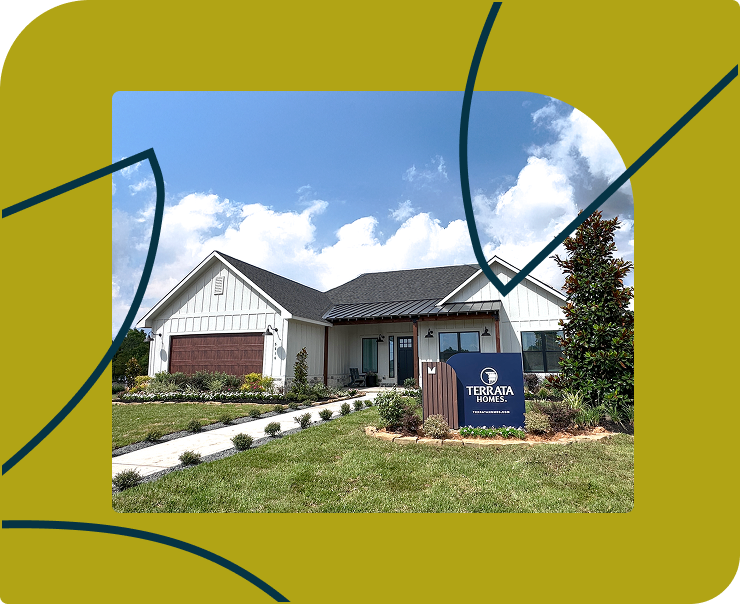 A modern single-story house with a Terrata Homes sign in front, landscaped yard, and blue sky with clouds in the background. Yellow border with blue lines frames the image.